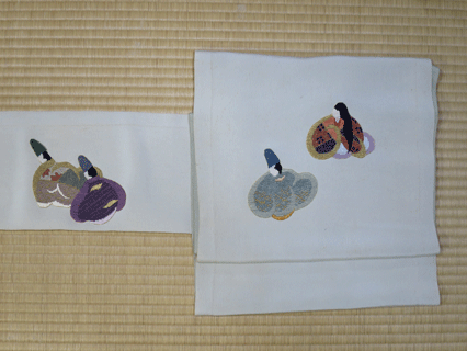 人形模様名古屋帯